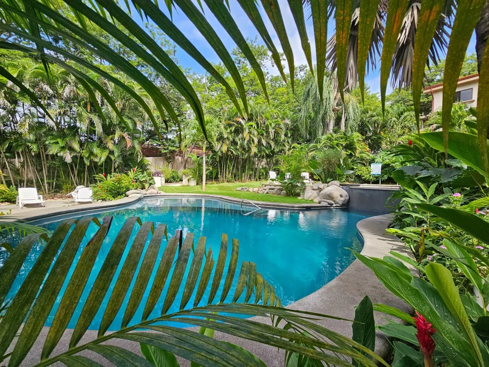 Serena Condos Playas del Coco pool and tropical landscaping